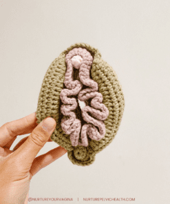 Hand holding new crochet vulva model